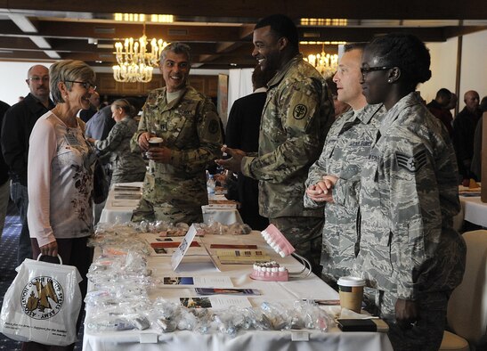 Retirees and their spouses visit informational booths during a Retiree Appreciation Week event at Ramstein Air Base, Germany, Oct. 4, 2016. Members of Kaiserslautern Military Community organizations came together to assist the retiree population by providing information and answering questions about different topics such as medical appointments and financial assistance. (U.S. Air Force photo by Senior Airman Larissa Greatwood)