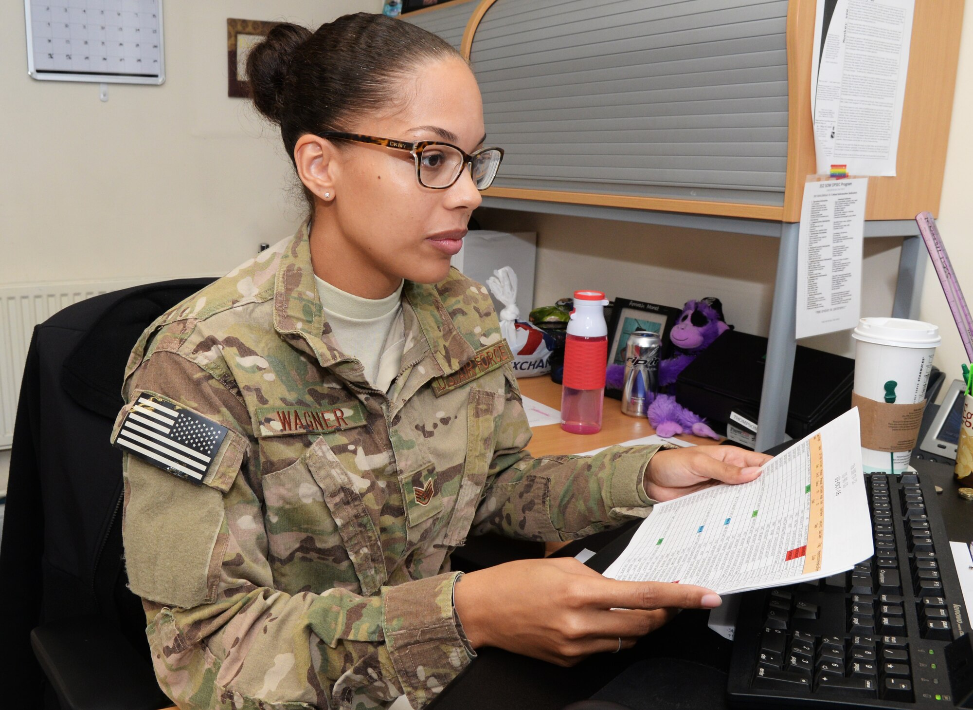 U.S. Air Force Staff Sgt. Lauren Wagner, 7th Special Operations Squadron NCO in charge of aviation resource management, works at her computer Oct. 6, 2016, on RAF Mildenhall, England. Wagner was submitted for the Square-D-Spotlight for being an outstanding member of Team Mildenhall. (U.S. Air Force photo by Airman 1st Class Tenley Long) 