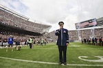 U.S. Air Force Master Sgt. Eric Sullivan, a baritone vocalist with the United States Air Force Band’s “Singing Sergeants”, sings “The Star-Spangled Banner” before an NFL football game at Soldier Field in Chicago, Ill., Oct. 2, 2016. Sullivan performed the national anthem for an audience of more than 60,800 people as part of the unit’s community relations mission. 