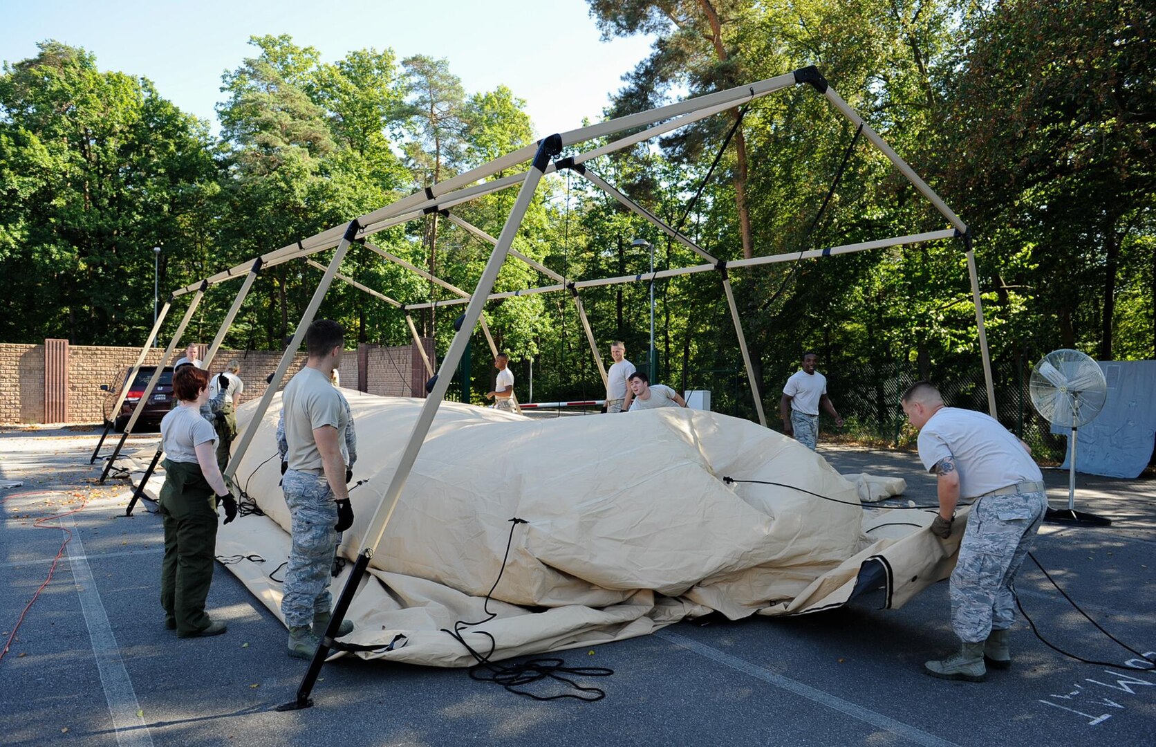 Airmen from the 86th Medical Support Squadron’s medical logistics flight take down a tent at Ramstein Air Base, Germany, Sept. 29, 2016. War reserve material technicians cleaned out tents that were used during Exercise Immediate Response 2016 in Slovenia, which took place from Sept. 9 to 23. (U.S. Air Force photo by Airman 1st Class Savannah L. Waters)
