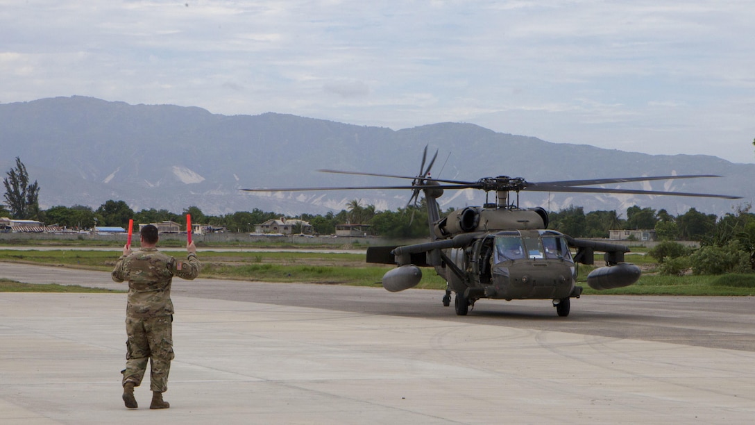 U.S. Marines with Special Purpose Marine Air-Ground Task Force – Southern Command and soldiers from Joint Task Force-Bravo’s 1st Battalion, 228th Aviation Regiment arrive by CH-53E Super Stallion, CH-47 Chinook, and UH-60L Black Hawk helicopters at Port-au-Prince, Haiti, Oct. 6, 2016. These vertical take-off assets will prove critical in gaining access to areas that are otherwise unreachable due to Hurricane Matthew. The Marines and soldiers are a part of Joint Task Force Matthew, a U.S. Southern Command-directed team deployed to Port-au-Prince at the request of the Government of Haiti, on a mission to provide humanitarian and disaster relief assistance in the aftermath of Hurricane Matthew.