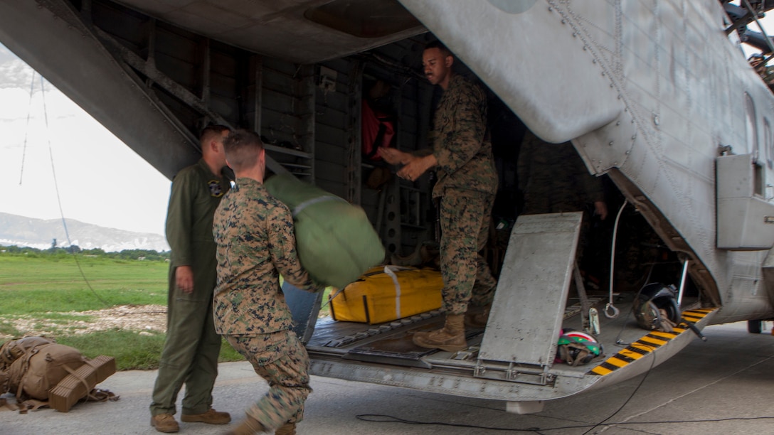 U.S. Marines with Special Purpose Marine Air-Ground Task Force – Southern Command and soldiers from Joint Task Force-Bravo’s 1st Battalion, 228th Aviation Regiment arrive by CH-53E Super Stallion, CH-47 Chinook, and UH-60L Black Hawk helicopters at Port-au-Prince, Haiti, Oct. 6, 2016. These vertical take-off assets will prove critical in gaining access to areas that are otherwise unreachable due to Hurricane Matthew. The Marines and soldiers are a part of Joint Task Force Matthew, a U.S. Southern Command-directed team deployed to Port-au-Prince at the request of the Government of Haiti, on a mission to provide humanitarian and disaster relief assistance in the aftermath of Hurricane Matthew.