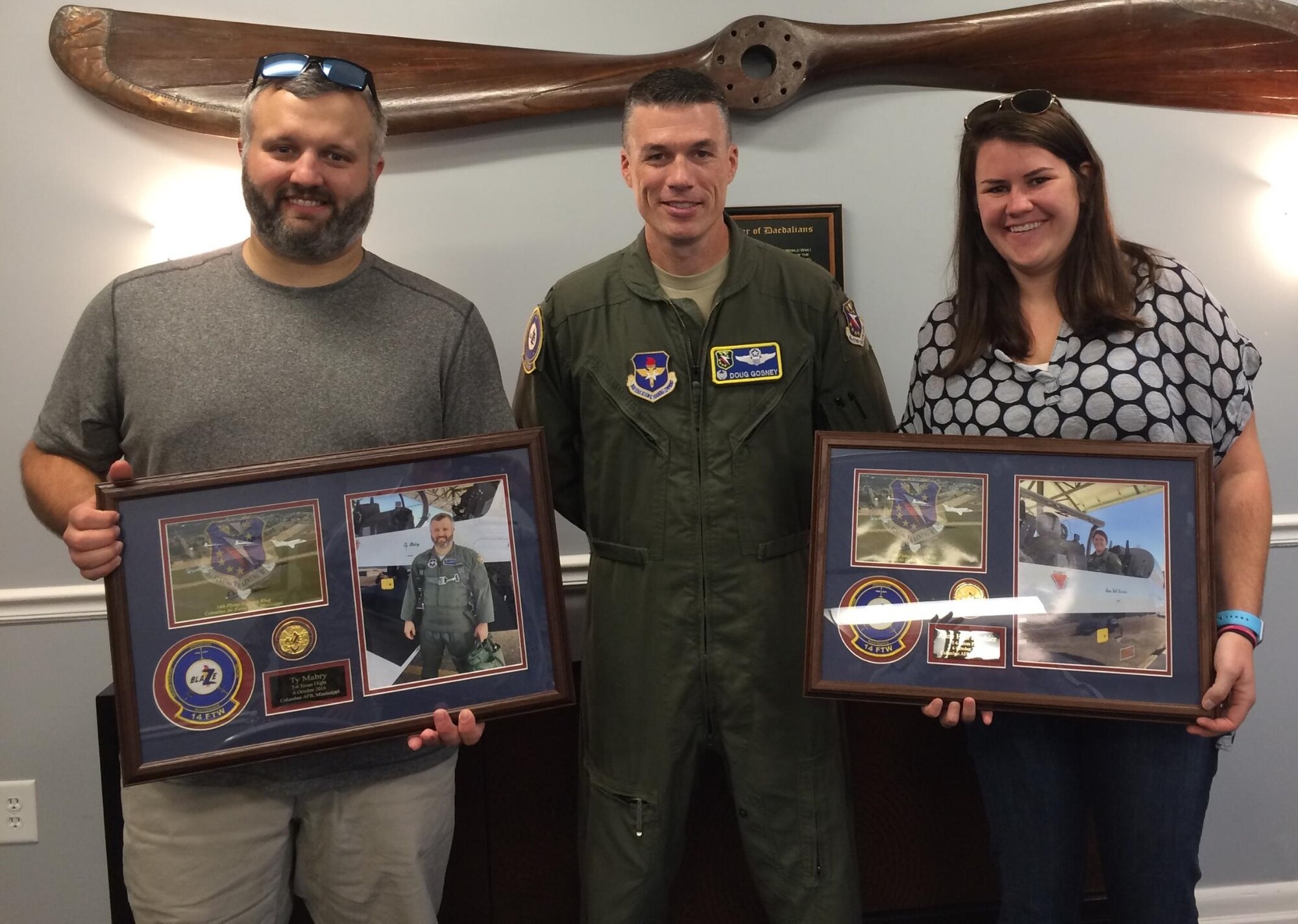 Ty Mabry and Anne Hall Brashier, Military Legislative Aides for Sen. Thad Cochran of Mississippi, pause for a photo with Col. Doug Gosney, 14th Flying Training Wing Commander, after their T-6 Texan II orientation flights Oct. 6 at Columbus Air Force Base, Mississippi. The staffers, who were able to experience Air Force aviation for the first time, called it “the highlight of the year.” (U.S. Air Force photo by Richard Johnson) 