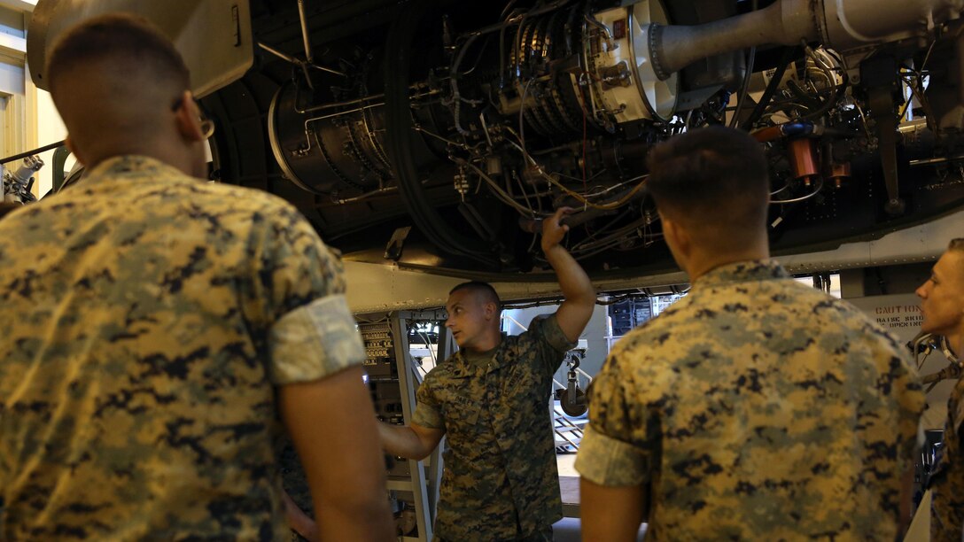 Sgt. David J. Dailey instructs students on how the CH-53 helicopter is assembled at the Center for Naval Aviation Technical Training on Marine Corps Air Station New River, Oct. 3, 2016. CNATT trains Marines and Sailors in operational maintenance and repair of aeronautical equipment at the air station. Dailey is an instructor at CNATT.
