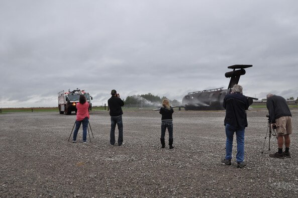 The 910th Civil Engineer Squadron fire department demonstrates the water cannon on one of the crash trucks for a group of photographers participating in Scott Kelby’s Worldwide Photowalk on Oct. 1, 2016 here. Seven photographers from eastern Ohio and western Pennsylvania participated in the walk at YARS. The group spent time on station photographing fire department trucks, equipment and personnel. They ended their visit with lunch at the Community Activity Center. According to the walk website, the walk is a social photography event where photographers get together to walk around, shoot photos and have fun with other photographers. (U.S. Air Force photo/Maj. Polly Orcutt)