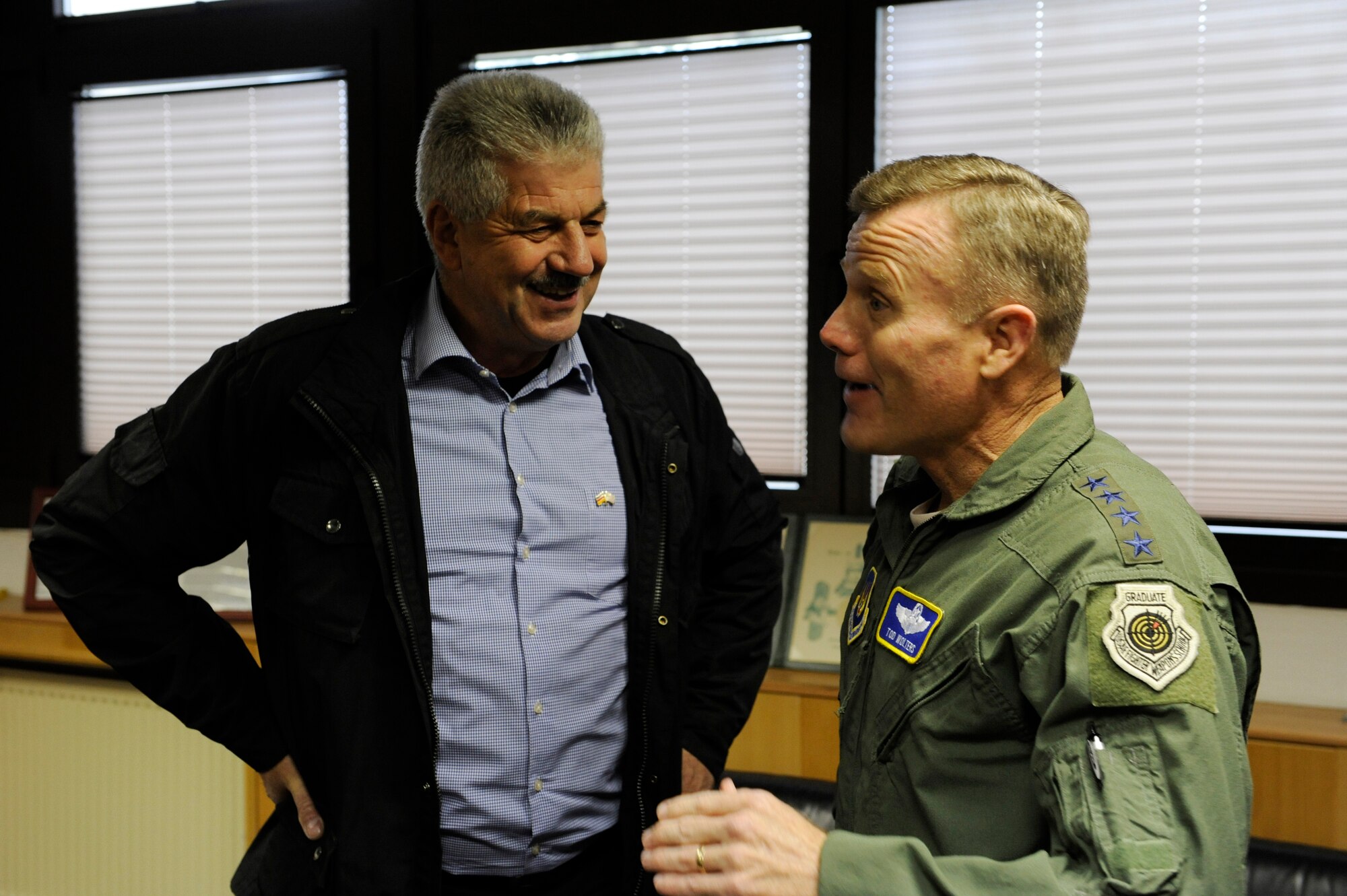 Gen. Tod D. Wolters, U.S. Air Forces in Europe and Air Forces Africa commander, right, visits with Klaus Rodens, Mayor of Spangdahlem, Germany, left, while touring Spangdahlem Air Base, Germany, Oct. 6, 2016. Wolters made his first visit to Spangdahlem since assuming command in August 2016. He spoke to Airmen on the importance their missions and highlighted his command priorities. (U.S. Air Force photo by Senior Airman Joshua R. M. Dewberry)