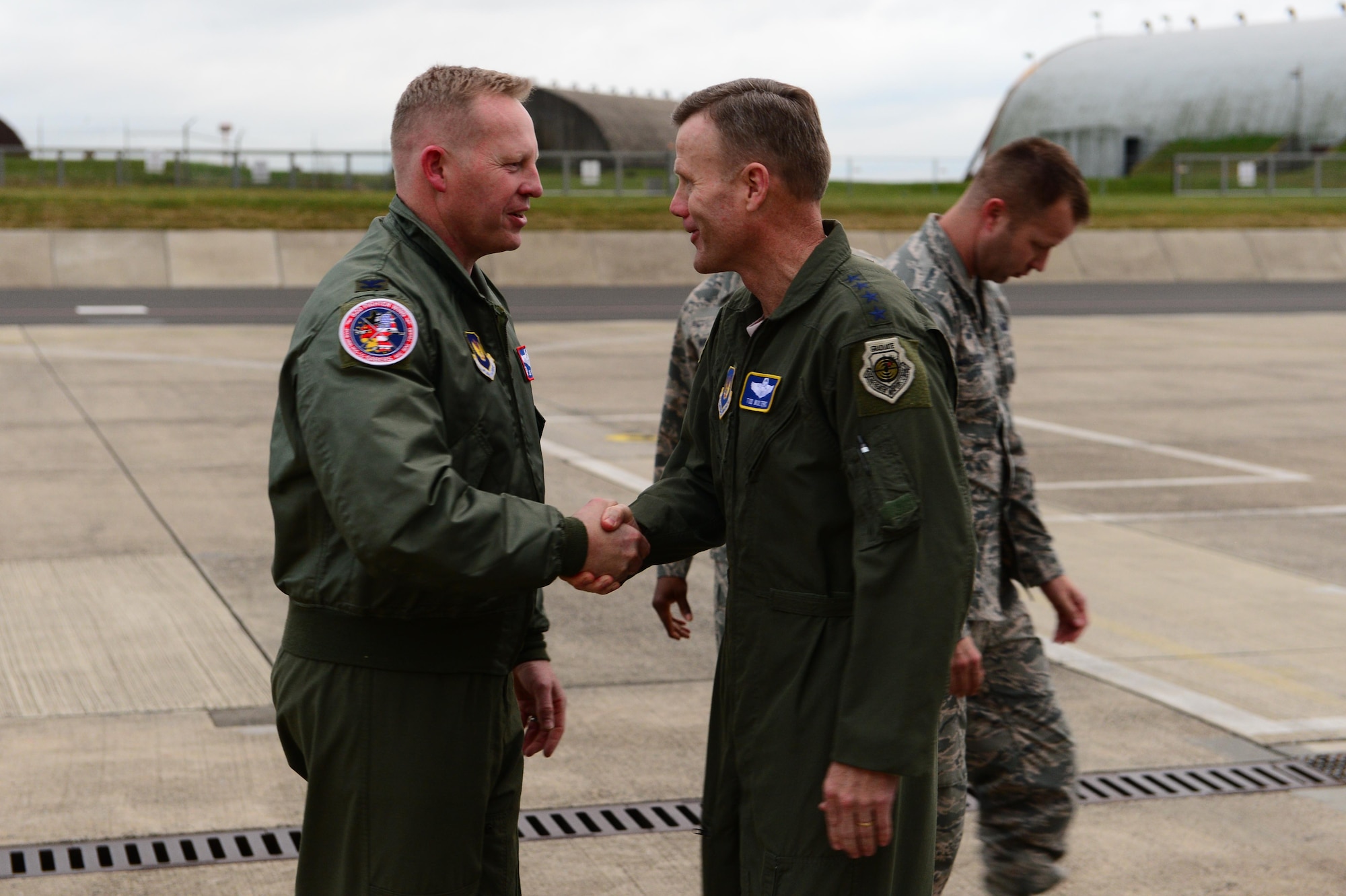 Gen. Tod D. Wolters, U.S. Air Forces in Europe and Air Forces Africa commander, right, shakes hands with Col. Joe McFall, 52nd Fighter Wing commander, left, before departing Spangdahlem Air Base, Germany, Oct. 6, 2016. Wolters made his first visit to Spangdahlem since assuming command in August 2016, speaking to Airmen on the importance their missions and highlighting his mission priorities. (U.S. Air Force photo by Senior Airman Joshua R. M. Dewberry)