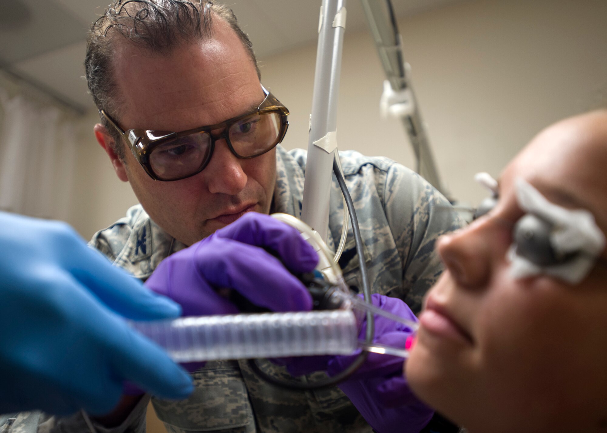Col. (Dr.) Chad Hivnor, laser and research chief with the 59th Medical Specialty Squadron, uses a fractional carbon dioxide laser to treat a patient’s scar at the Wilford Hall Ambulatory Surgical Center on Joint Base San Antonio-Lackland, Texas, Oct. 7. The laser treatment, also known as fractional skin resurfacing, goes deep into the epidermis of the skin and stimulates the production of collagen to create firm and smooth skin. Hivnor recently earned the San Antonio Business Journal 2016 Health Care Hero award for his contributions to health care in the local community. (U.S. Air Force photo/Staff Sgt. Kevin Iinuma) 