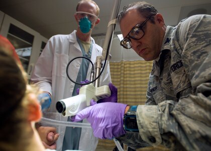 Col. (Dr.) Chad Hivnor, laser and research chief with the 59th Medical Specialty Squadron, uses a fractional carbon dioxide laser to treat a patient’s scar at the Wilford Hall Ambulatory Surgical Center on Joint Base San Antonio-Lackland, Texas, Oct. 7. The laser treatment, also known as fractional skin resurfacing, goes deep into the epidermis of the skin and stimulates the production of collagen to create firm and smooth skin. Hivnor recently earned the San Antonio Business Journal 2016 Health Care Hero award for his contributions to health care in the local community. (U.S. Air Force photo/Staff Sgt. Kevin Iinuma) 