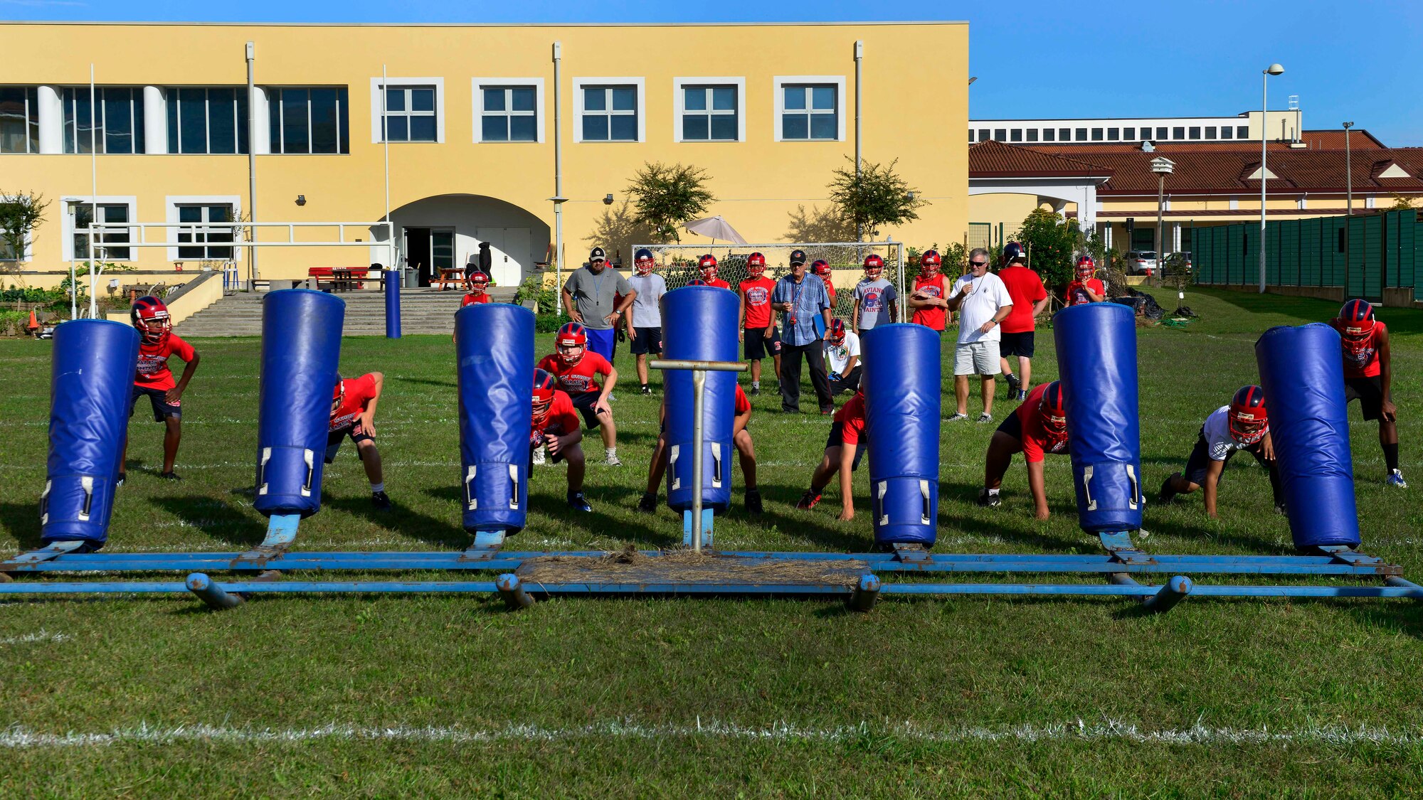 Aviano Saints football players perform practice drills at Aviano Air Base, Italy on Oct. 4, 2016. The coaches work to improve the player’s football and life skills. (U.S. Air Force photo by Airman 1st Class Cary Smith/Released)