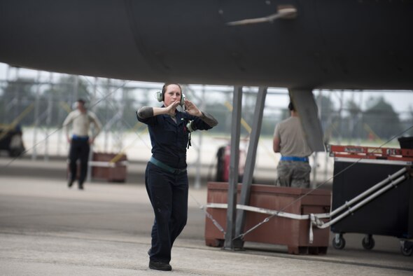 A crew chief assigned to the 4th Aircraft Maintenance Squadron marshals an F-15E Strike Eagle for departure as a precautionary measure due to Hurricane Matthew, Oct. 6, 2016, at Seymour Johnson Air Force Base, North Carolina. More than 40 F-15E Strike Eagles and six KC-135R Stratotanker aircraft repositioned to Barksdale Air Force Base, Louisiana, to avoid potential damage from high winds and rain associated with Matthew. (U.S. Air Force photo by Senior Airman Brittain Crolley)