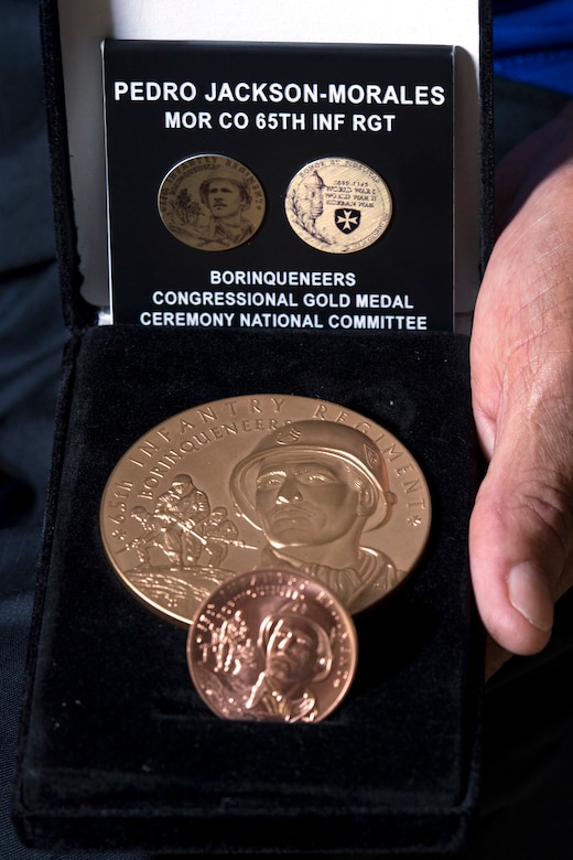 Korean War veteran Army Pfc. Pedro Jackson Morales holds a Congressional Gold Medal in Cabo Rojo, Puerto Rico, Aug. 10, 2016. DoD photo by EJ Hersom