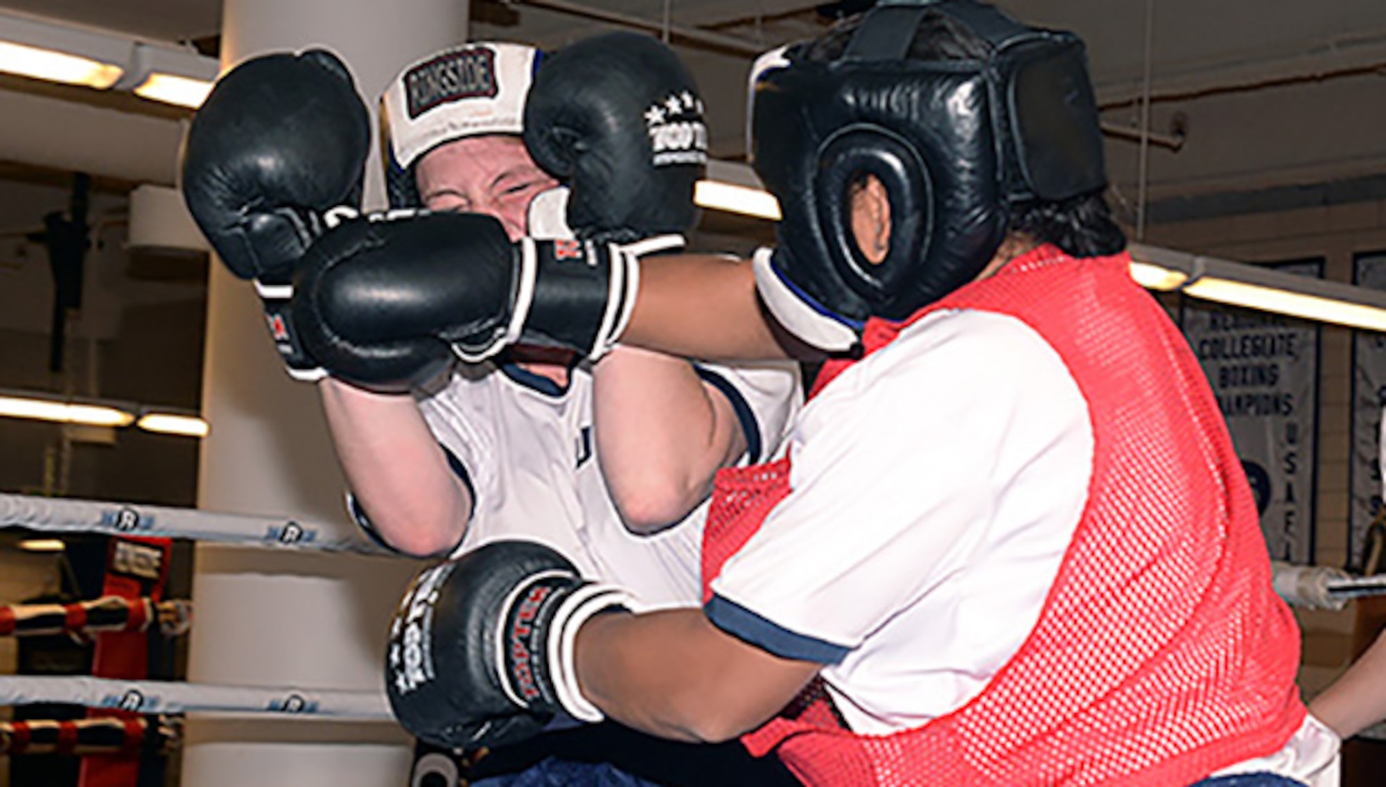 Two female cadets spar in a boxing ring Oct. 6, 2016, at the U.S. Air Force Academy. Previously, women took the Academy’s mandatory Combatives I and II courses, but only male cadets were required to put on boxing gloves. The change follows Defense Department guidelines published in January opening combat roles to women. (U.S. Air Force photo/Darcie Ibidapo)
