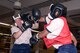 Two female cadets spar in a boxing ring Oct. 6, 2016, at the U.S. Air Force Academy. Boxing at the Academy opened this year for female cadets to correspond with Defense Department guidelines published in January 2016 that opened combat positions to women in the military. (U.S. Air Force photo/Darcie Ibidapo)