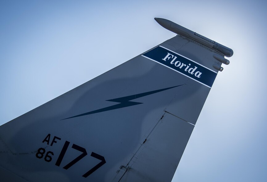 A 125th Fighter Wing F-15’s lightning bolt tail flash blocks out the morning sun on the Eglin Air Force Base flightline Oct. 7.  The Air National Guard unit from Jacksonville, Fla., sent 15 aircraft to ride out Hurricane Matthew here. The Marine Fighter Attack Training Squadron-501 sent 10 F-35Bs from South Carolina to the base for sheltering as well. The 96th Aircraft Maintenance Squadron's F-15 unit and the Navy's Strike Fighter Squadron 101 provided support to the transient aircraft. (U.S. Air Force photo/Samuel King Jr.)