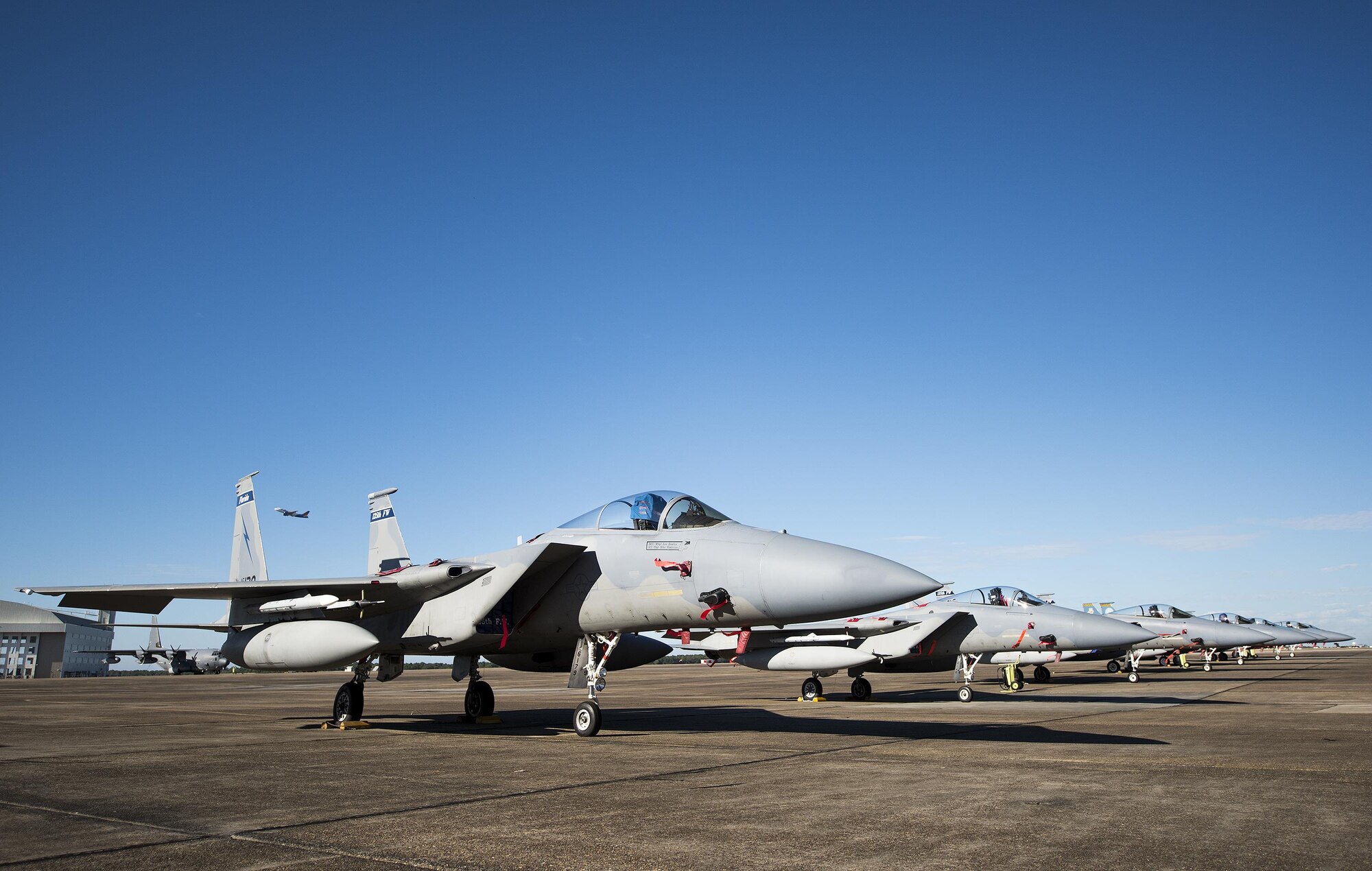 A row of 125th Fighter Wing F-15s from Jacksonville Fla., stack the Eglin Air Force Base flightline Oct. 7.  The Air National Guard unit sent 15 aircraft to ride out Hurricane Matthew here. The Marine Fighter Attack Training Squadron-501 sent 10 F-35Bs from South Carolina to the base for sheltering as well. The 96th Aircraft Maintenance Squadron's F-15 unit and the Navy's Strike Fighter Squadron 101 provided support to the transient aircraft. (U.S. Air Force photo/Samuel King Jr.)