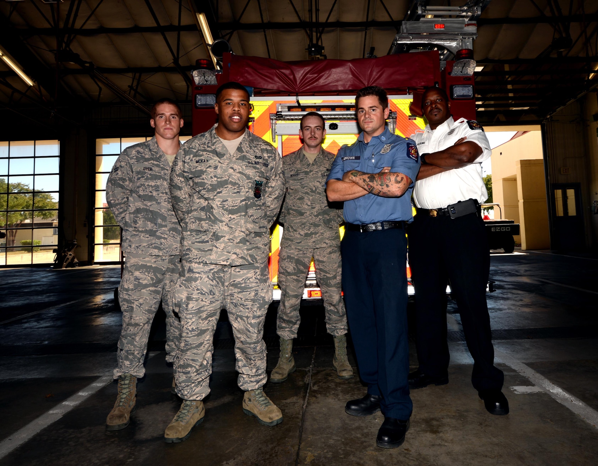 From left to right, Airman 1st Class Travis Dyer, Airman 1st Class Jonathan McKay, Staff Sgt. Mark Morris II, Jay Brown, Chavis Perine, not pictured Senior Airman Jem Beck, Senior Airman Rishad Simmons and Jeffrey Thoroughman, Oct. 5, 2016, Maxwell Air Force Base, Ala. These fire fighters responded and administered CPR to a man experiencing a heart attack, ultimately saving his life. (U.S. Air Force photo/Senior Airman Alexa Culbert)