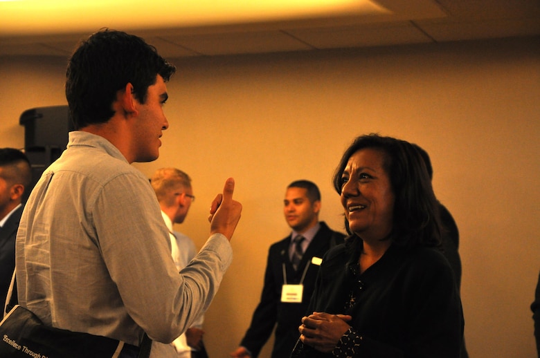 Jennie Ayala, Outreach Coordinator for the Corps' Los Angeles District, explains the Corps' intern program to a prospective engineer during a seminar at HENAAC.