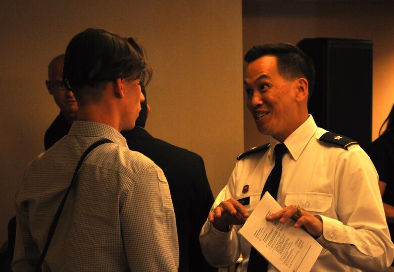 Brig. Gen. Mark Toy talks with a student during the Corps' job opportunity seminar held at HENAAC in Anaheim, California. "Find your passion," Toy said.