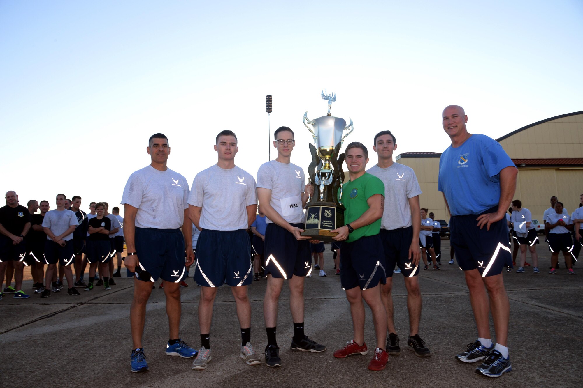 42nd Air Base Wing commander, Col. Eric Shafa and 42nd Air Base Wing vice commander, Col. Barry Dickey announce the Wing Staff Agency as this month's Commander's Challenge winners, Sept. 30, 2016. The Commander's Challenge is a competition comprised of running and strength exercises held during the monthly wing run. (U.S. Air Force photo/ Senior Airman Alexa Culbert)