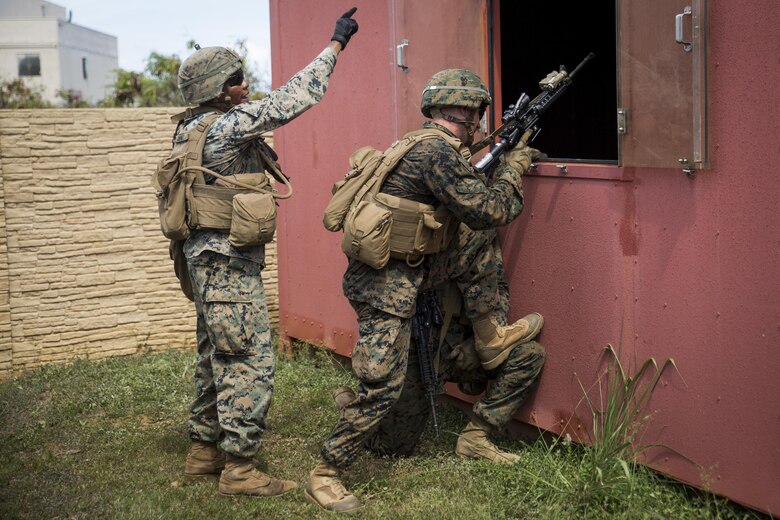 MARINE CORPS BASE HAWAII – Marines from Alpha Company, 1st Battalion, 3rd Marine Regiment, practice clearing buildings during Exercise Island Viper aboard Marine Corps Base Hawaii, Sept. 27, 2016. Marines wrap up their final week of Exercise Island Viper, an annual pre-deployment training event preparing Marines for a larger exercise in the Pacific Region. During Exercise Island Viper, the Marines practiced clearing buildings, patrolling through simulated villages, solved obstacles at the Leadership Reaction Course and traversing through an Improvising Explosive Devices course. (U.S. Marine Corps Photo by Lance Cpl. Jesus Sepulveda Torres)