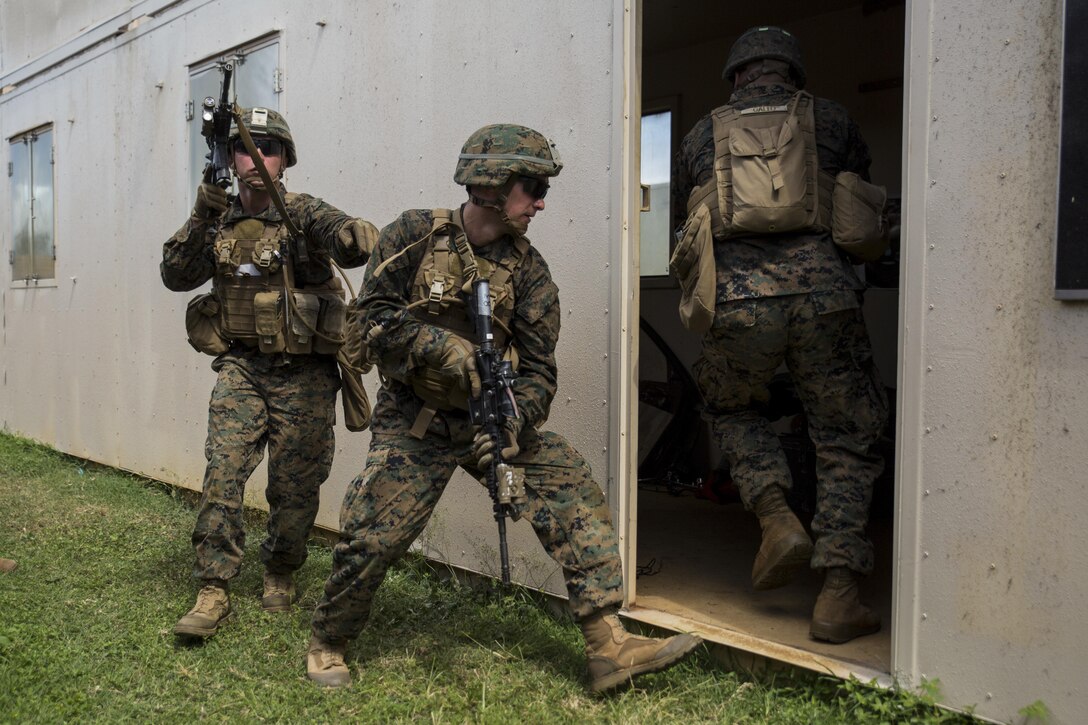 MARINE CORPS BASE HAWAII – Marines from Alpha Company, 1st Battalion, 3rd Marine Regiment, practice clearing buildings during Exercise Island Viper aboard Marine Corps Base Hawaii, Sept. 27, 2016. Marines wrap up their final week of Exercise Island Viper, an annual pre-deployment training event preparing Marines for a larger exercise in the Pacific Region. During Exercise Island Viper, the Marines practiced clearing buildings, patrolling through simulated villages, solved obstacles at the Leadership Reaction Course and traversing through an Improvising Explosive Devices course. (U.S. Marine Corps Photo by Lance Cpl. Jesus Sepulveda Torres)