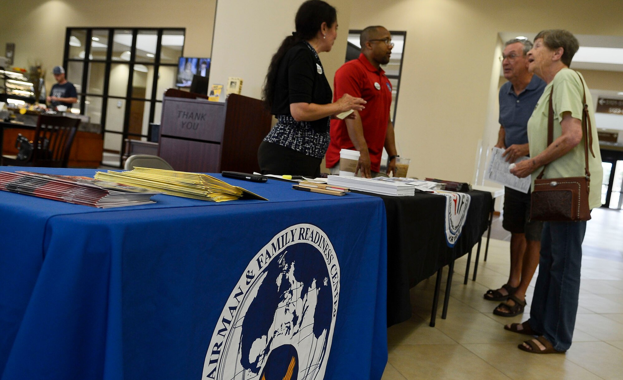 Nelly Richards and Thamers Jones, members assigned to the 6th Force Support Squadron Airman and Family Services Flight, informs evacuees of available services at MacDill Air Force Base, Fla., Oct. 7, 2016. In addition to providing lodging to the evacuees, the MacDill Lanes Bowling Alley provided free shoes and games, the Youth Center opened its gymnasium to provide displaced children with a place to play, and a free movie was offered at the base theater. (U.S. Air Force photo by Senior Airman Jenay Randolph)   