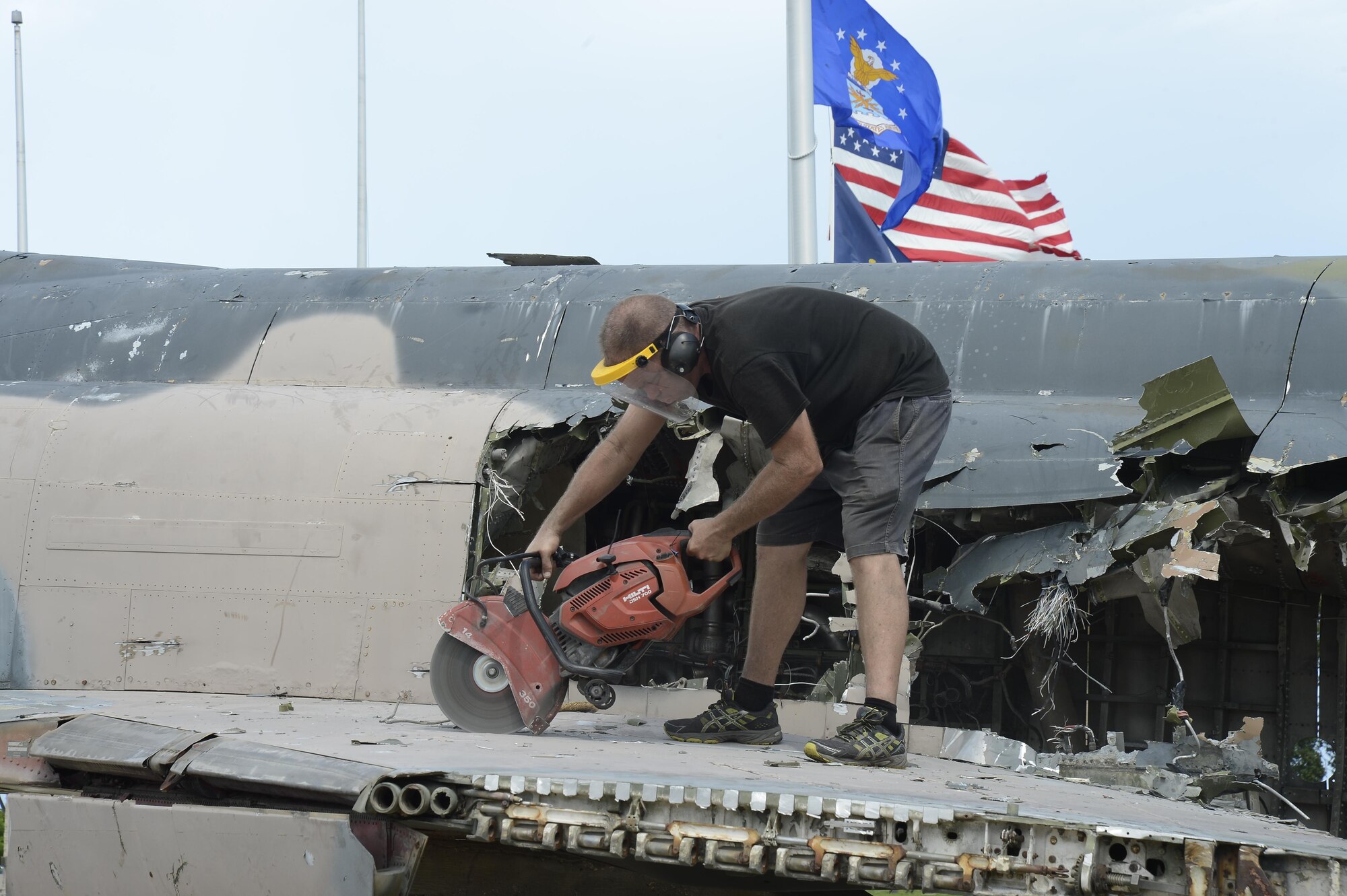 Contractors tear down the F-4 Phantom, Sept. 29, 2016, in Memorial Air Park at MacDill Air Force Base, Fla. The tear down was scheduled to be a two-week process. (U.S. Air Force photo by Senior Airman Randolph)