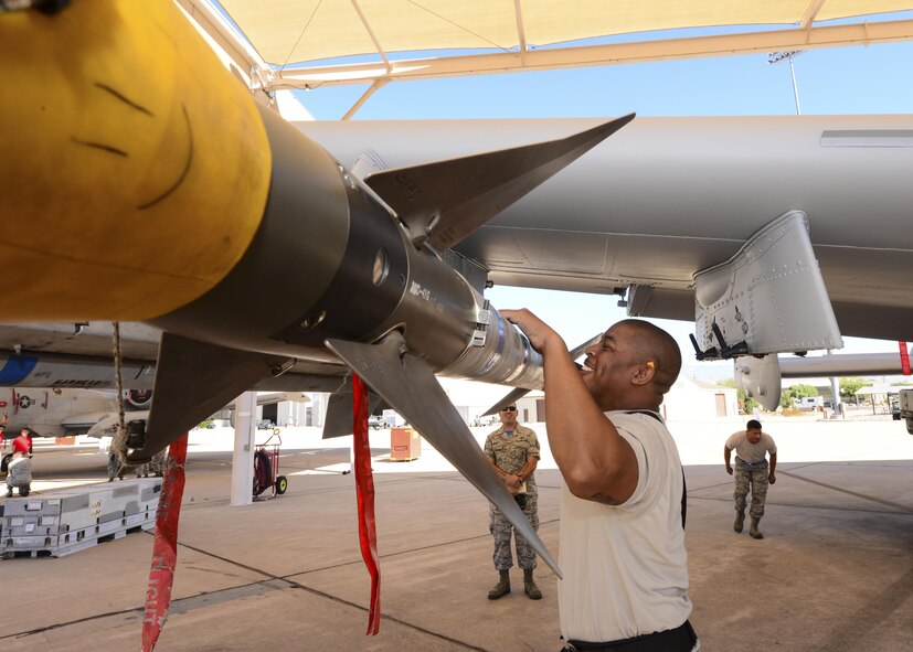 U.S. Air Force Staff Sgt. Leon Jones, 354th Aircraft Maintenance Unit weapons load crew chief, inspects an AIM-9 Sidewinder missile that was loaded onto an A-10C Thunderbolt II during a load crew of the quarter competition at Davis-Monthan Air Force Base, Ariz., Oct. 7, 2016. The load crews were evaluated based on timeliness and deficiencies during the contest. (U.S. Air Force photo by Airman Nathan H. Barbour)