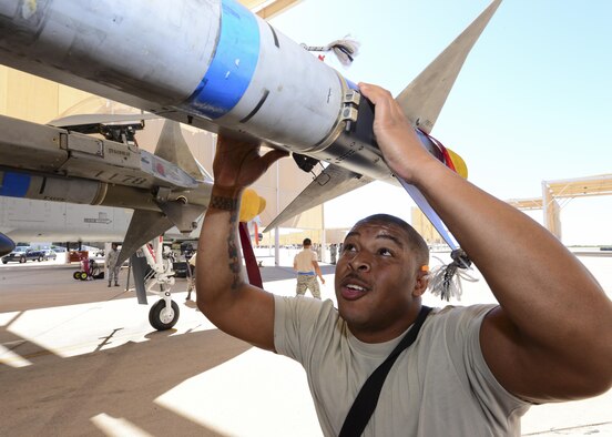 U.S. Air Force Staff Sgt. Leon Jones, 354th Aircraft Maintenance Unit weapons load crew chief, inspects an AIM-9 Sidewinder missile that was loaded onto an A-10C Thunderbolt II during a load crew of the quarter competition at Davis-Monthan Air Force Base, Ariz., Oct. 7, 2016. The objective of the competition is to determine which team can most efficiently load an A-10 with munitions with the least amount of deficiencies. (U.S. Air Force photo by Airman Nathan H. Barbour)