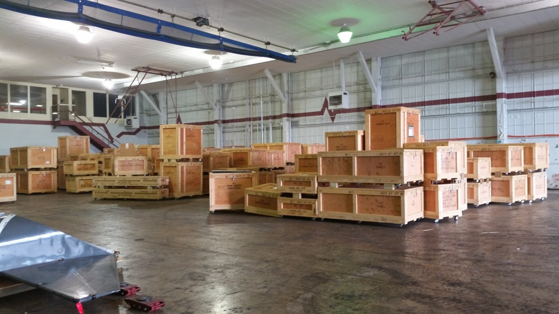 For Other Maintenance, or FOM, crates are shown stacked on the floor before installation of the ACTIVRAC 16 mobile high-density and permanent storage shelves. (Courtesy photo)