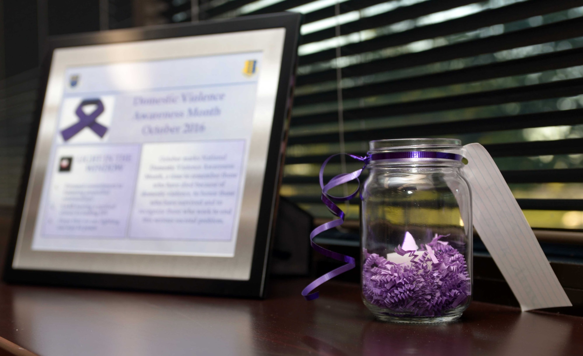 Candles were presented to base leadership as a part of Domestic Violence Awareness Month at Ellsworth Air Force Base, S.D., Sept. 27, 2016. Notes written by victims at the Working Against Violence, Inc. shelter in Rapid City were attached to the candles in an effort to provide support and encouragement to other victims. (U.S. Air Force photo by Airman 1st Class Donald C. Knechtel)