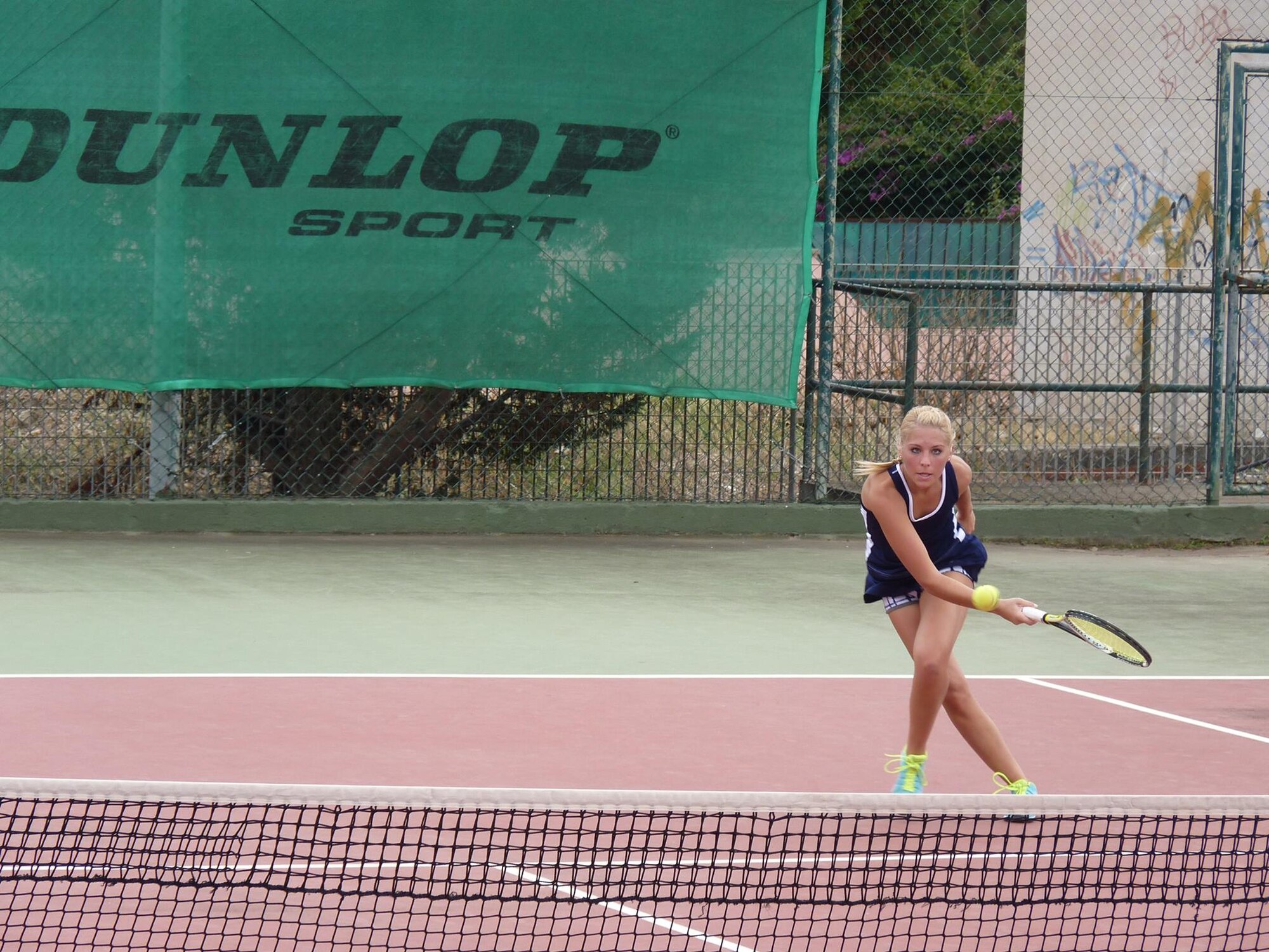 U.S. Air Force 1st Lt. Anastasia Hueffner, 17th Force Support Squadron sustainment deputy flight director, plays tennis during the Headquarters Air Command Tennis Championship 2016 Sardegna in Cagliari, Italy Sept. 28. Hueffner has played tennis competitively since she was 10 years old. (Courtesy photo)