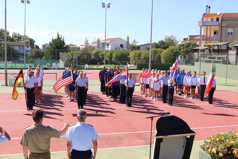 Five teams stand at attention during the opening ceremony for the Headquarters Air Command Tennis Championship 2016 Sardegna in Cagliari, Italy Sept. 19. NATO countries compete every two years in a variety of sports. (Courtesy photo)