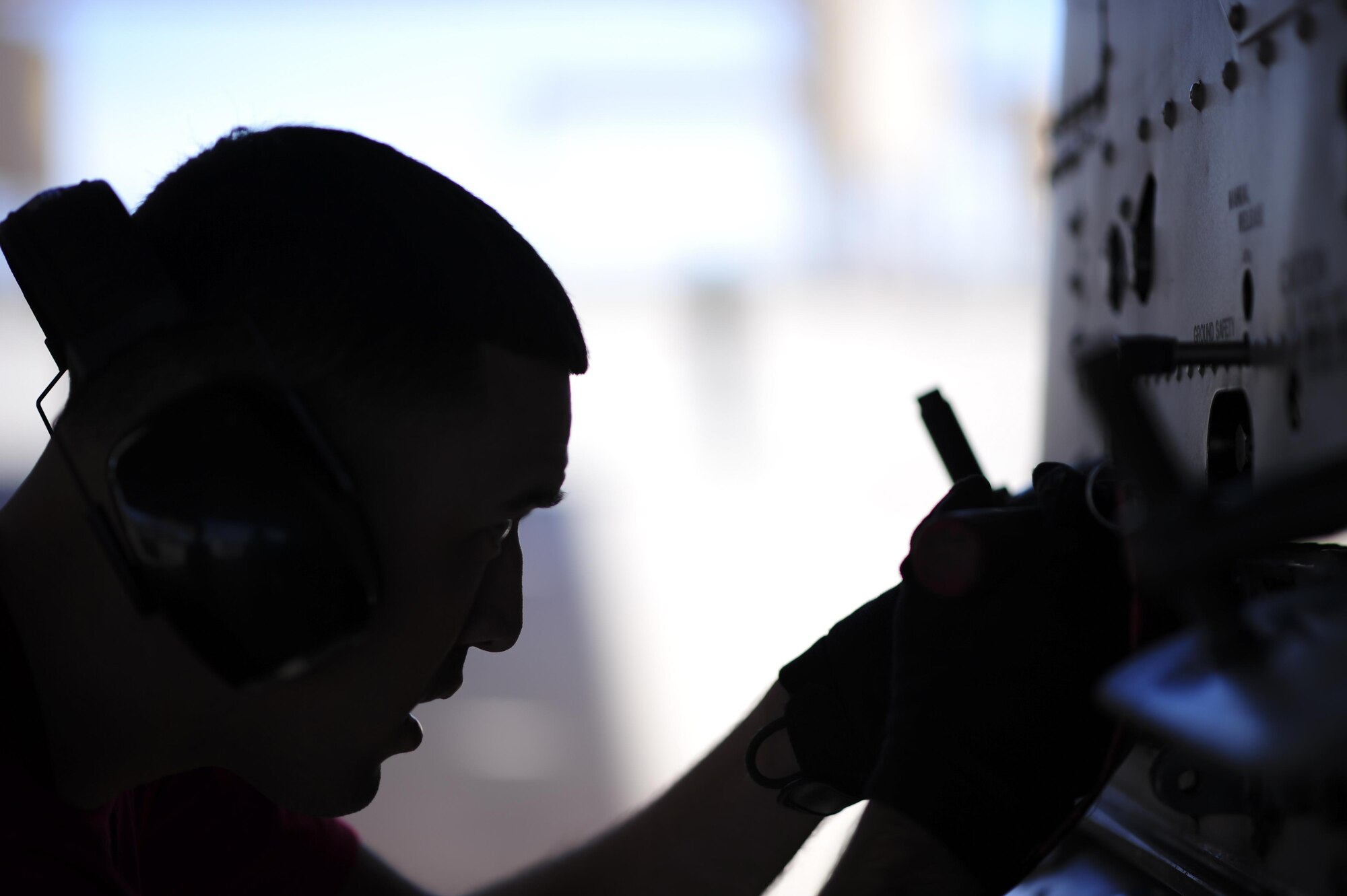 U.S. Air Force Airman 1st Class Edgar Baez-Lopez, 355th Aircraft Maintenance Squadron weapons load crew member, sets the ejector feet on the loaded station of an A-10C Thunderbolt II during a weapons load crew competition at Davis-Monthan Air Force Base, Ariz., Oct. 7, 2016. This quarter's weapons load crew competition was between the 354th, 357th and 924th aircraft maintenance units. (U.S. Air Force photo by Senior Airman Chris Drzazgowski)