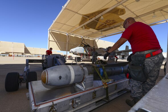 U.S. Airmen from the 355th Aircraft Maintenance Squadron check an AGM-65 Maverick missle for damage and serviceability during a weapons load crew competition at Davis-Monthan Air Force Base, Ariz., Oct. 7, 2016. This quarter's competition was between the 354th, 357th and 924th aircraft maintenance units. (U.S. Air Force photo by Senior Airman Chris Drzazgowski)