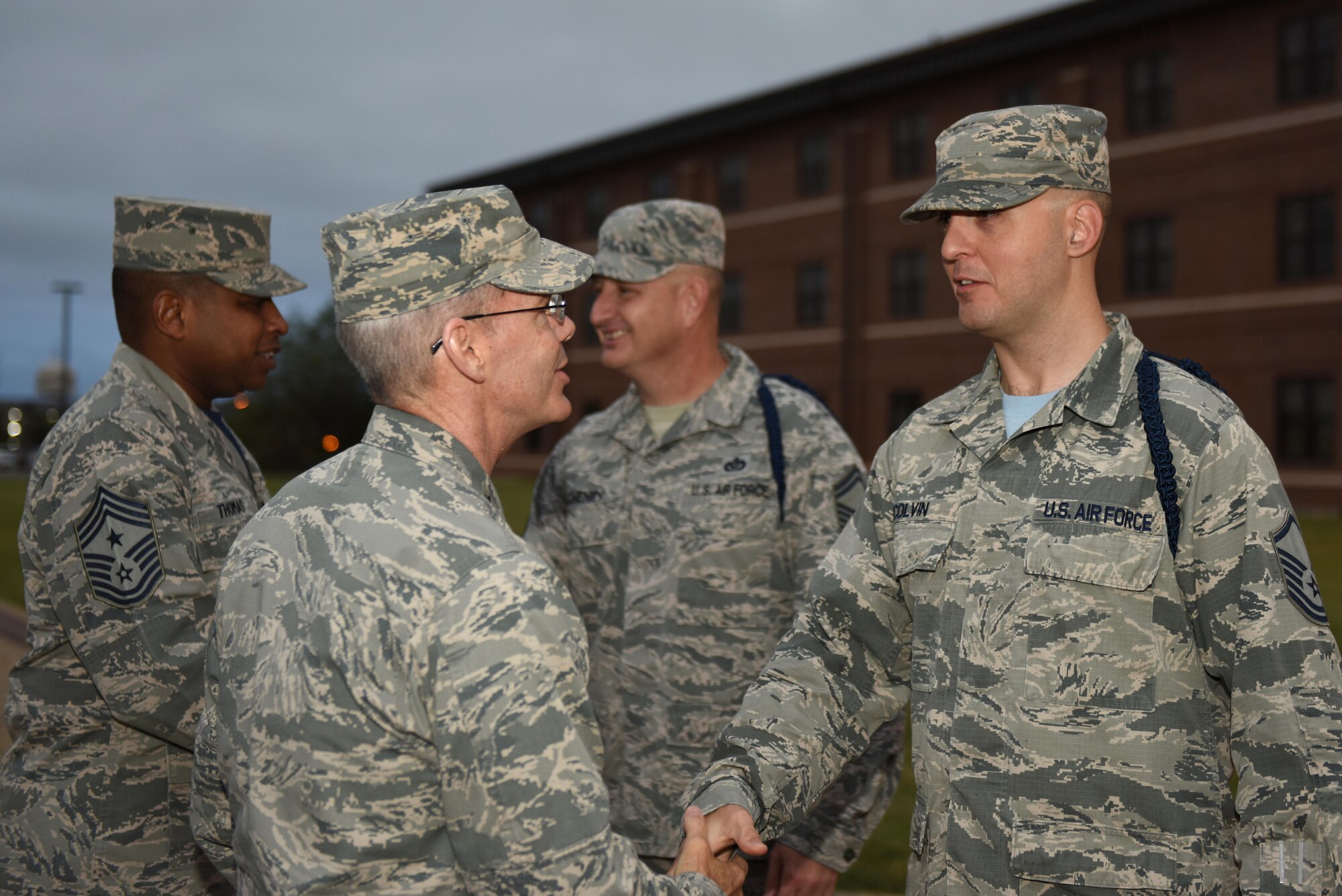 U.S. Air Force Maj. Gen. Bob LaBrutta, 2nd Air Force Commander, meets Master Sgt. Gregory Colvin, 316th Training Squadron military training leader flight chief, outside of the student dorms on Goodfellow Air Force Base, Texas, Oct. 7, 2016. During his two-day base tour, LaBrutta had a sit down session with MTLs and answered any questions they had. (U.S. Air Force photo by Airman 1st Class Caelynn Ferguson/Released)