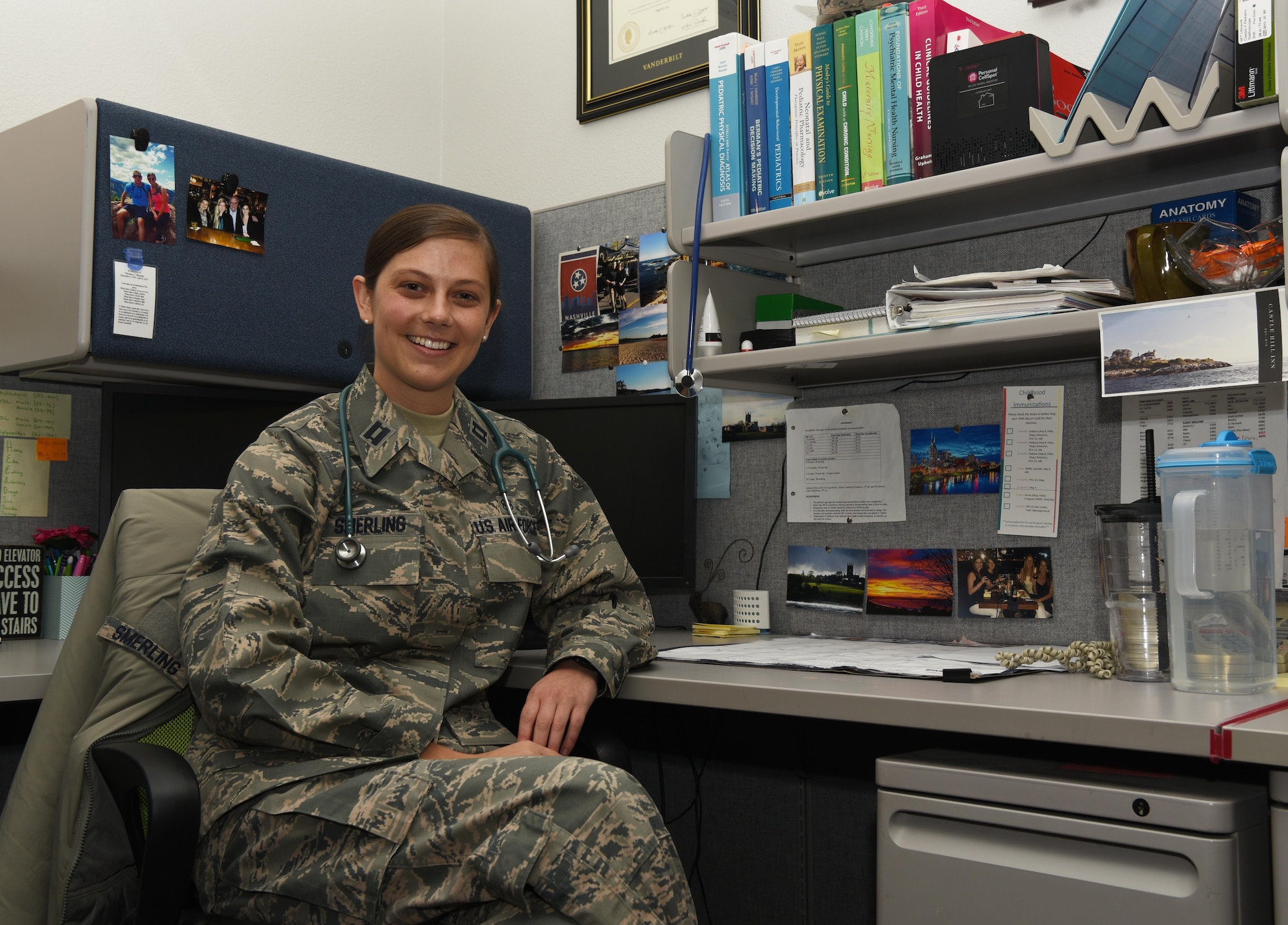 Capt. Kelly Smerling, 90th Medical Operations Squadron pediatric nurse practitioner, sits at her desk at F.E. Warren Air Force Base, Wyo., Sept. 29, 2016. Pediatrics is one of many sections in the 90th MOS that provides medical care. (U.S. Air Force photo by Airman 1st Class Breanna Carter)