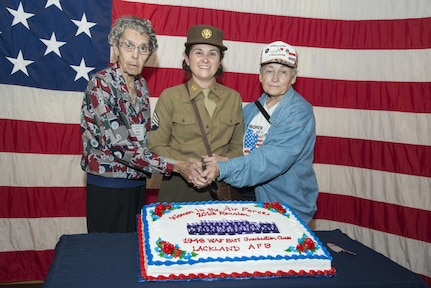 Members of the Women in the Air Force, including Chief Master Sgt. Dorothy Holmes, left, the first woman to reach 30 years in the Air Force, cut a celebratory cake during the Joint Base San Antonio WAF Reunion Oct. 7 at JBSA-Lackland. WAF was founded in 1948 out of the Women’s Armed Service Integration Act, which enabled tens of thousands of female service members to find jobs in the Air Force. In 1976 women were accepted into the service on an equal basis with men. 