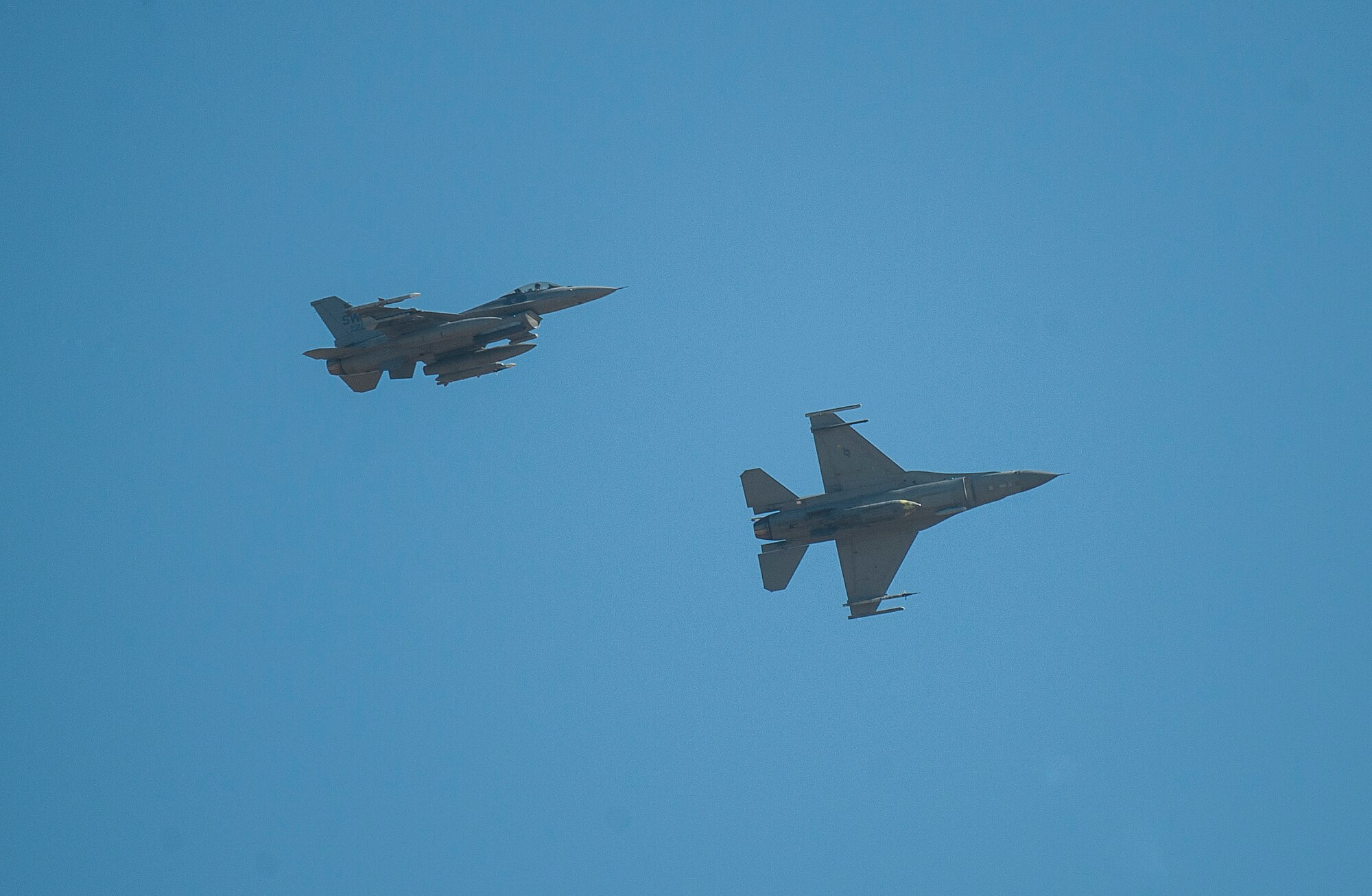 Two F-16 Fighting Falcons fly above Barksdale Air Force Base, La., Oct. 6, 2016. . Hundreds of aircrew and more than 100 aircraft from Shaw Air Force Base, S.C., Joint Base Charleston, S.C., and Seymour Johnson Air Force Base, N.C., relocated to avoid potential damage from high winds associated with Hurricane Matthew along the East Coast. (U.S. Air Force photo/Airman Alexis C. Schultz) 