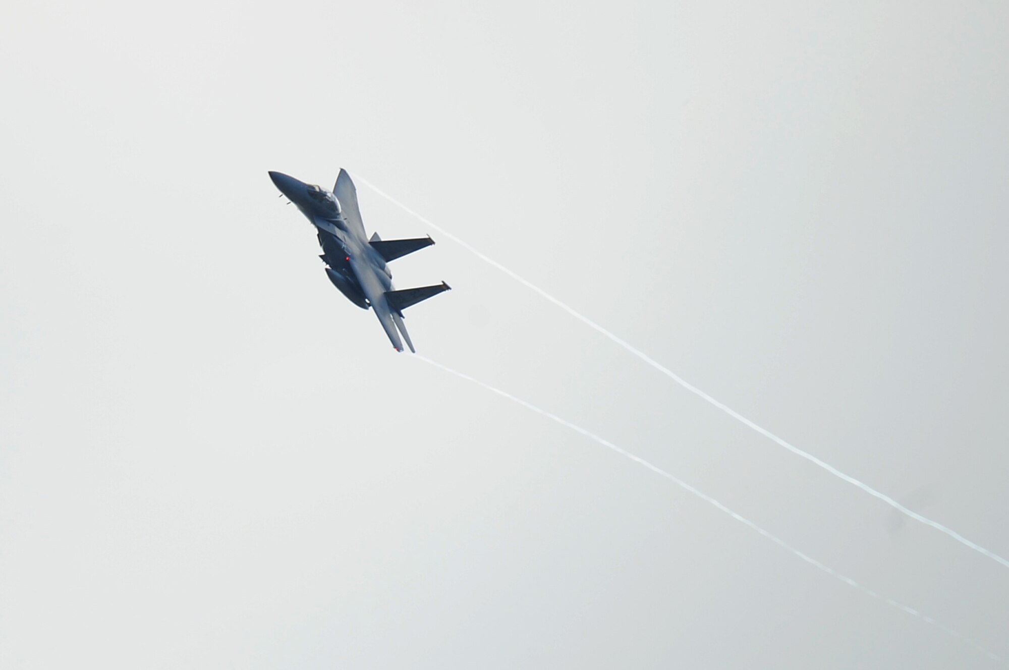 A F-15 Strike Eagle from Seymour Johnson Air Force Base, N.C., flies above Barksdale Air Force Base, La., Oct. 5, 2016. Hundreds of Airmen and a large contingent of aircraft including F-15 Strike Eagles, F-16 Fighting Falcons, C-17 Globemaster IIIs and KC-135 Stratotankers began arriving here today from Shaw Air Force Base, S.C., Joint Base Charleston, S.C., and Seymour Johnson, to avoid potential damage from high winds associated with Hurricane Matthew along the East Coast.(U.S. Air Force photo/Airman Alexis C. Schultz)