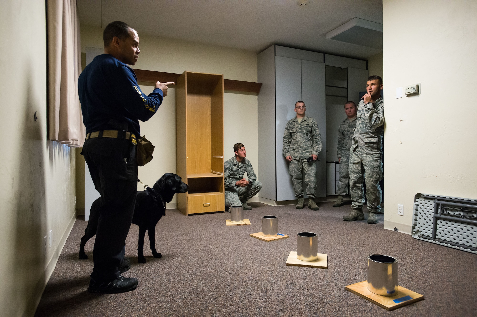Bureau of Alcohol, Tobacco, Firearms and Explosives Special Agent Rennie Mora talks with Airmen during military working dog imprint training Oct. 5 at Hill Air Force Base. Airmen and their K-9 counterparts, along with dog teams from local, state and federal law enforcement agencies, received homemade explosives detection training from Bureau of Alcohol, Tobacco, Firearms and Explosives agents Oct. 5-6. (U.S. Air Force photo by R. Nial Bradshaw)
