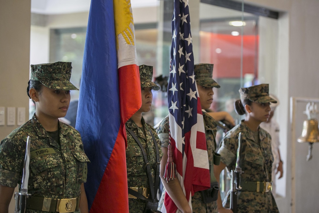 U.S. and Philippine Marine color guard members await the start of the Philippine Amphibious Landing Exercise 33 (PHIBLEX) opening ceremony at Marine Barracks Rudiardo Brown, Taguig City, Philippines, Oct. 4, 2016. PHIBLEX is an annual U.S.-Philippine military bilateral exercise which combines amphibious capabilities and live-fire training with humanitarian civic assistance efforts to strengthen interoperability and working relationships. The U.S. Marines are with 3d Marine Expeditionary Brigade, III Marine Expeditionary Force. (U.S. Marine Corps photo by Cpl. Steven Tran/Released)
