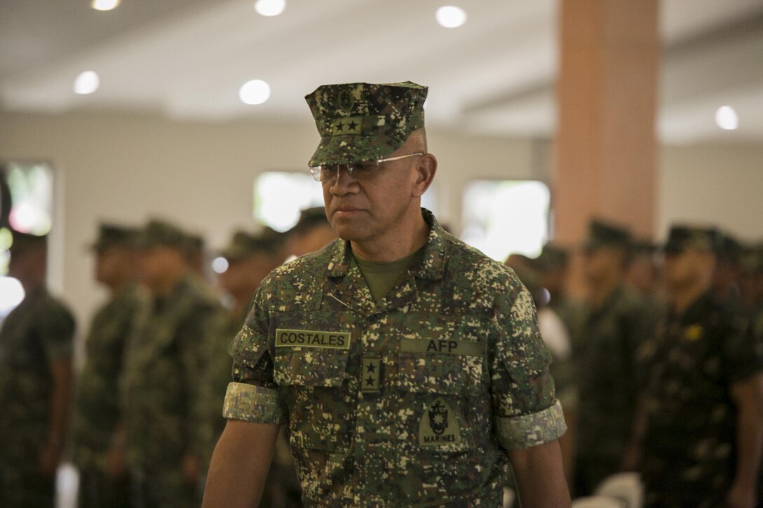 Philippine Marine Maj. Gen. Andre M. Costales Jr., commandant of the Philippine Marine Corps, marches to the stage of the Philippine Amphibious Landing Exercise 33 (PHIBLEX) opening ceremony at Marine Barracks Rudiardo Brown, Taguig City, Philippines, Oct. 4, 2016. PHIBLEX is an annual U.S.-Philippine military bilateral exercise which combines amphibious capabilities and live-fire training with humanitarian civic assistance efforts to strengthen interoperability and working relationships. (U.S. Marine Corps photo by Cpl. Steven Tran/Released)