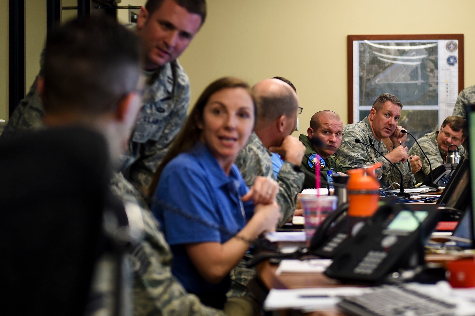 U.S. Air Force Col. Robert Lyman, Joint Base Charleston commander, discusses current and ongoing operations at the Emergency Operations Center during Hurricane Condition I for Hurricane Matthew on Joint Base Charleston, S.C., Oct. 7, 2016. All non-essential personnel evacuated the area, but will return after disaster response coordinators assess damage and verify a safe operating environment. (U.S. Air Force photo by Senior Airman Nicholas Byers)