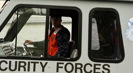 U.S. Navy Petty Officer 2nd Class William Roberts, a harbor patrol coxswain with the 628th Security Forces Squadron, prepares to move and store a 628th Security Forces patrol boat ahead of Hurricane Matthew at Joint Base Charleston - Naval Weapons Station, S.C., Oct. 7, 2016. All non-essential personnel evacuated the area but will return after disaster response coordinators assess damage and verify a safe operating environment.   (U.S. Air Force photo by Senior Airman Nicholas Byers)
