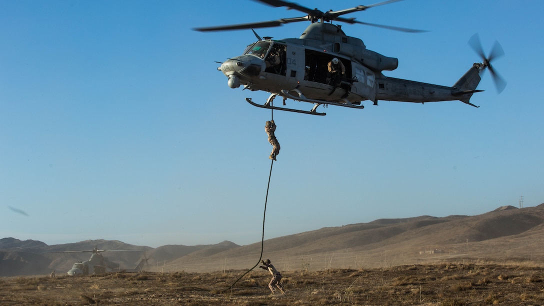 Marines with Marine Light Attack Helicopter Squadron  369 and 1st Reconnaissance Battalion, 1st Marine Division, conduct fast-rope training at Marine Corps Base Camp Pendleton, California, Oct. 3,2016.  Fast roping was part of a larger event called a Marine Air-Ground Task Force integration exercise, which enabled air and ground units to come together and cooperate in various training missions prior to their deployment with the 15th Marine Expeditionary Unit. 
