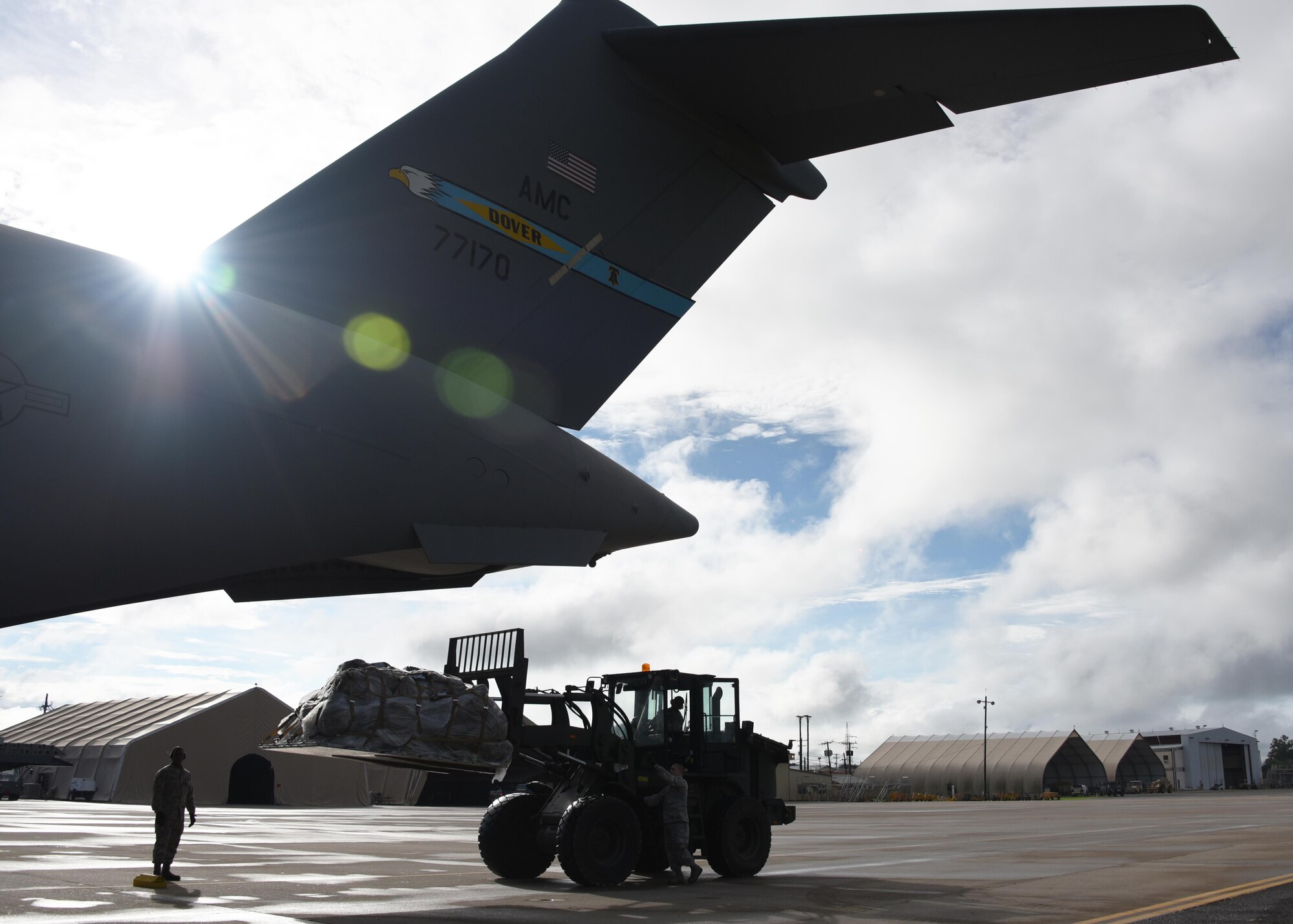 Logistics crews from the 612th Air Base Squadron load a C-17 Globemaster III cargo aircraft at Soto Cano Air Base, Honduras, with equipment destined for Port-au-Prince, Haiti to support Joint Task Force Matthew hurricane relief operations, Oct. 8, 2016. This C-17 was one of two aircraft rapidly deployed to Soto Cano to provide airlift for sustainment supplies and additional JTF-Bravo and Special Purpose Marine Air-Ground Task Force-Southern Command personnel who are conducting disaster relief efforts as part of JTF-Matthew using two CH-53E Super Stallion, three CH-47 Chinook, and two UH-60L and two HH-60L Black Hawk helicopters. (U.S. Air Force photo by Capt. David Liapis)