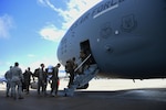 U.S. Marines with the Special Purpose Marine Air-Ground Task Force-Southern Command board a C-17 Globemaster III cargo aircraft at Soto Cano Air Base, Honduras, Oct. 8, 2016, for a deployment to Port-au-Prince, Haiti where they will augment approximately 150 other Soldiers, Airmen and Marines from Joint Task Force-Bravo and SPMAGTF-SC who deployed earlier this week with two CH-53E Super Stallion, three CH-47 Chinook, and two UH-60L and two HH-60L Black Hawk helicopters to provide heavy and medium lift to support the U.S. Agency for International Development-led mission. While in Haiti, SPMAGTF-SC and JTF-Bravo personnel are part of Joint Task Force Matthew, a temporary command established by SOUTHCOM in Port-au-Prince, under the command of U.S. Navy Rear Adm. Cedric Pringle, to coordinate and execute the combined Department of Defense supporting elements that include the Marine and Army aircraft from Soto Cano and ships and aircraft from the Navy, Air Force and Coast Guard. (U.S. Air Force photo by Capt. David Liapis) 