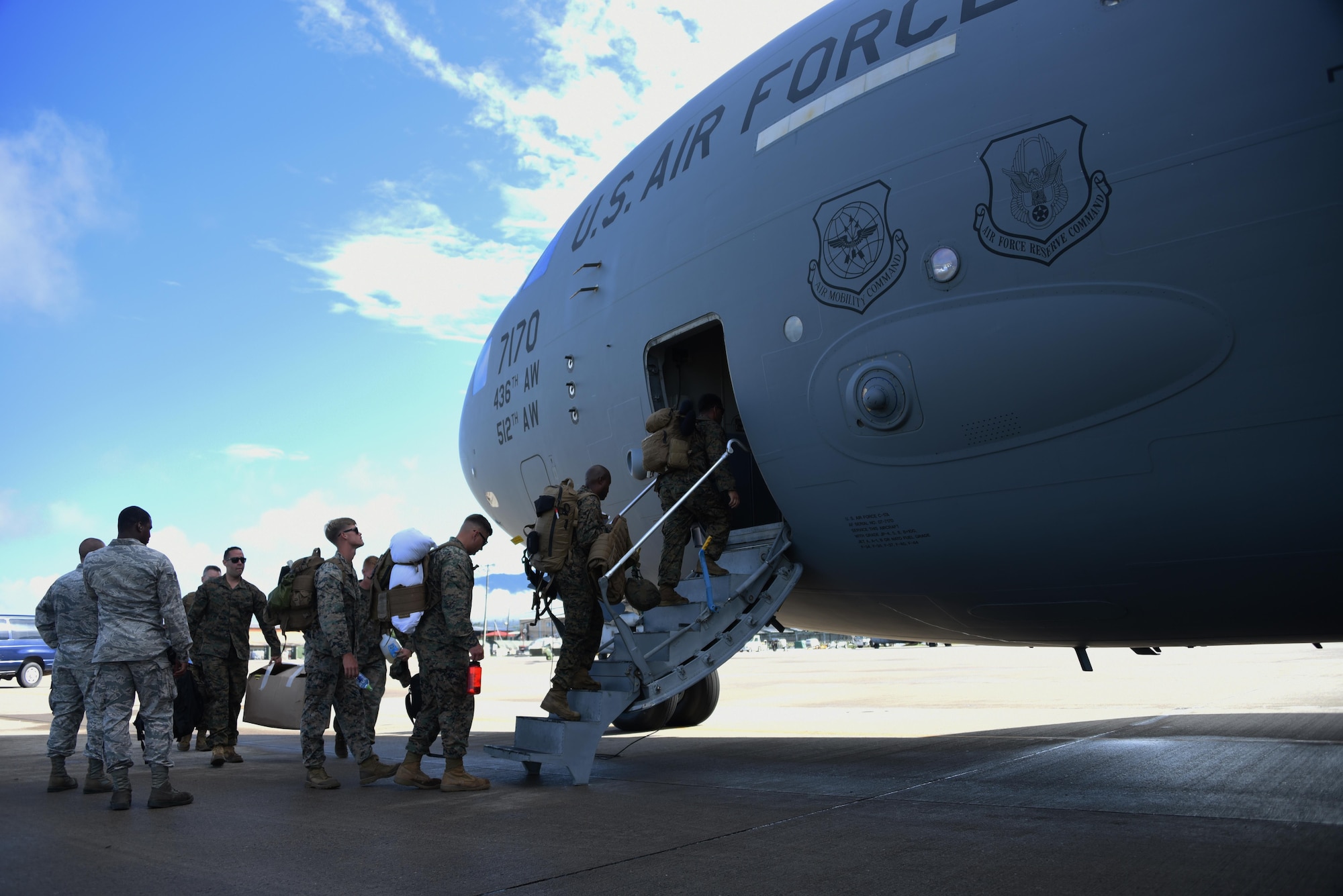 U.S. Marines with the Special Purpose Marine Air-Ground Task Force-Southern Command board a C-17 Globemaster III cargo aircraft at Soto Cano Air Base, Honduras, Oct. 8, 2016, for a deployment to Port-au-Prince, Haiti where they will augment approximately 150 other Soldiers, Airmen and Marines from Joint Task Force-Bravo and SPMAGTF-SC who deployed earlier this week with two CH-53E Super Stallion, three CH-47 Chinook, and two UH-60L and two HH-60L Black Hawk helicopters to provide heavy and medium lift to support the U.S. Agency for International Development-led mission. While in Haiti, SPMAGTF-SC and JTF-Bravo personnel are part of Joint Task Force Matthew, a temporary command established by SOUTHCOM in Port-au-Prince, under the command of U.S. Navy Rear Adm. Cedric Pringle, to coordinate and execute the combined Department of Defense supporting elements that include the Marine and Army aircraft from Soto Cano and ships and aircraft from the Navy, Air Force and Coast Guard. (U.S. Air Force photo by Capt. David Liapis) 